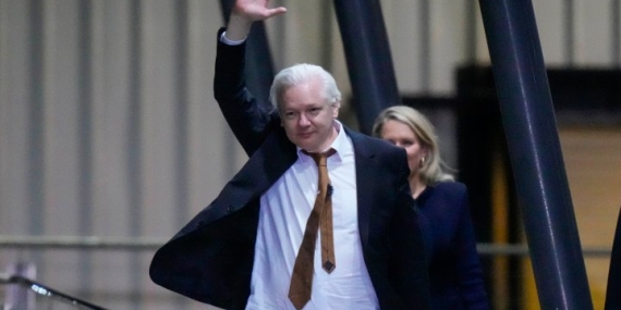 Julian Assange returns to Australia after being freed in plea deal  – National