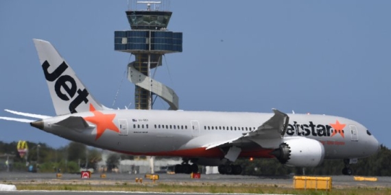 Plane passenger arrested after forcing open exit door and walking on wing – National