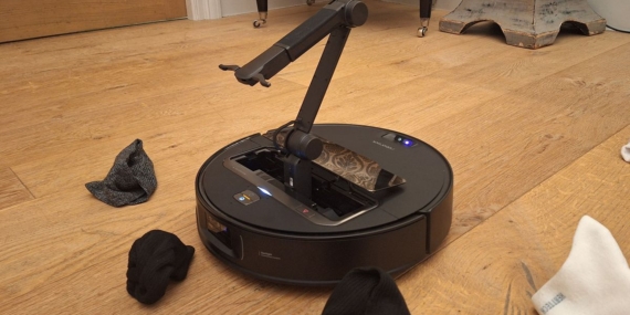 Roborock’s new robovac has a mechanical arm that can pick up your socks and maybe also play with your cat